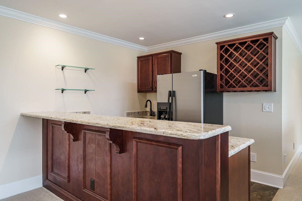 5327 Landguard Drive Raleigh, NC 27613 - Photo 41 of 45 Wet bar area and another section of the open basement perfect for a sectional and movie night! Basement