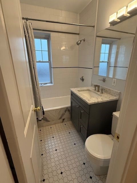 21 Bradlee Road, Unit 52 Medford, MA 02155 - Photo 11 of 22 a bathroom with a sink toilet and shower