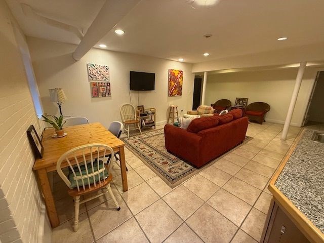 21 Bradlee Road, Unit 52 Medford, MA 02155 - Photo 17 of 22 a living room with furniture and a flat screen tv