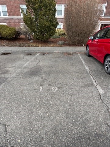 21 Bradlee Road, Unit 52 Medford, MA 02155 - Photo 21 of 22 a car parked on the side of a road