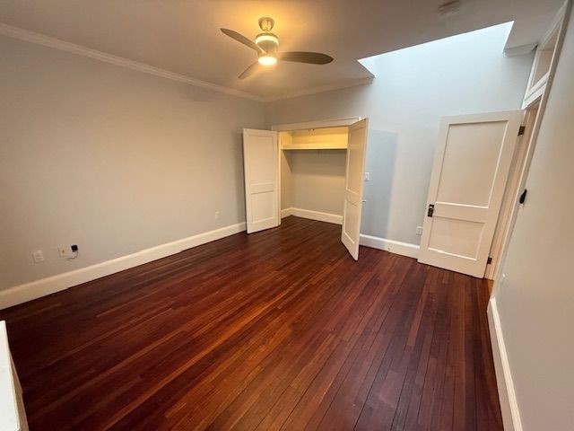 21 Bradlee Road, Unit 52 Medford, MA 02155 - Photo 4 of 22 wooden floor in an empty room with a window
