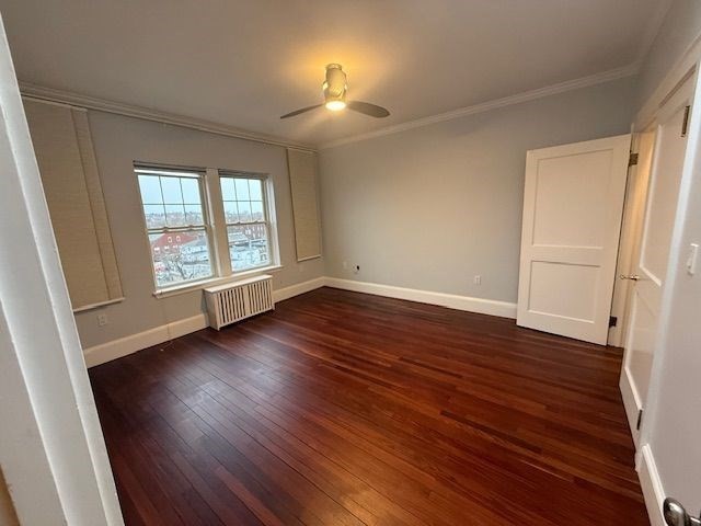 21 Bradlee Road, Unit 52 Medford, MA 02155 - Photo 5 of 22 an empty room with wooden floor and windows