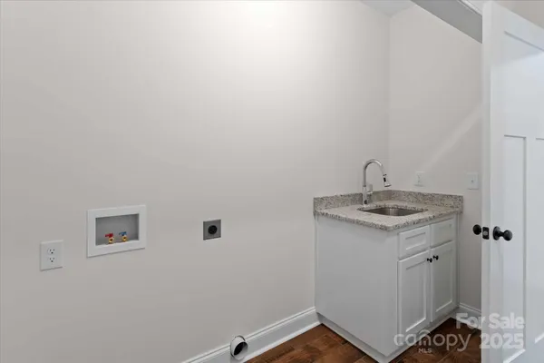 a bathroom with a sink and vanity