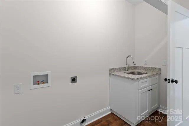 a bathroom with a sink and vanity