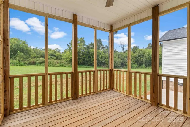 a view of a balcony with wooden floor