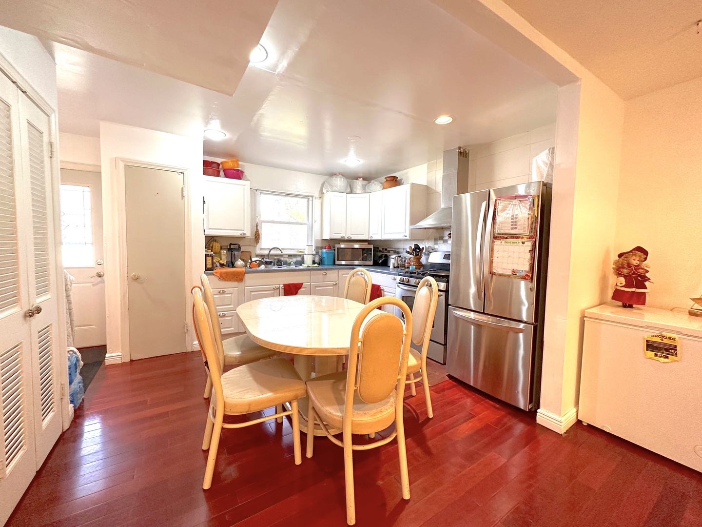 33 Crescent Road Lake Zurich, IL 60047 - Photo 4 of 15 a kitchen with stainless steel appliances a dining table chairs refrigerator and sink