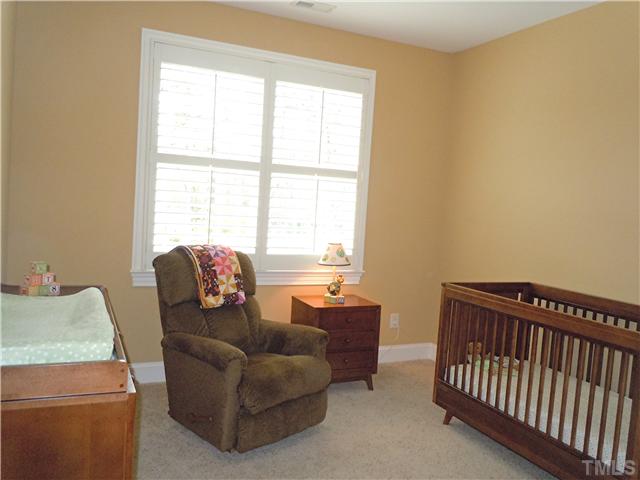 1305 Lions Way Raleigh, NC 27604 - Photo 15 of 25 a living room with furniture and a window