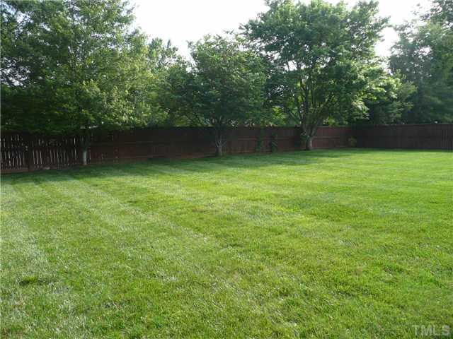 1305 Lions Way Raleigh, NC 27604 - Photo 25 of 25 a view of outdoor space with deck and yard