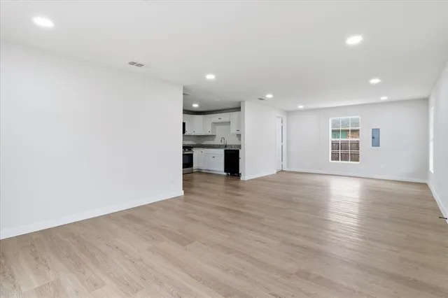 a view of a kitchen with a dishwasher and a refrigerator