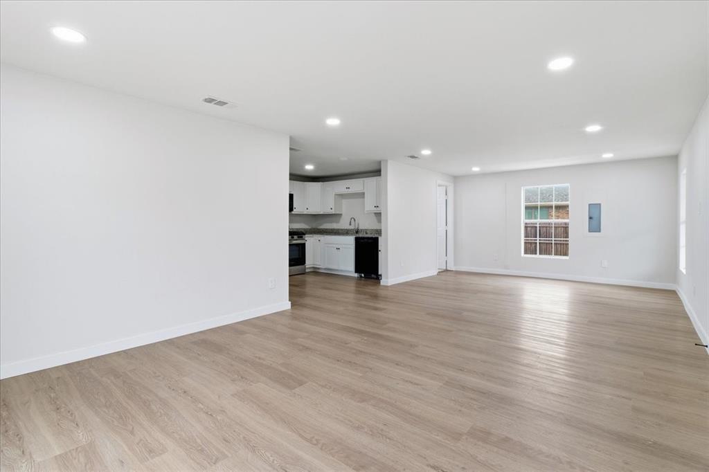 404 South Murray Street McKinney, TX 75069 - Photo 11 of 24 a view of a kitchen with a dishwasher and a refrigerator