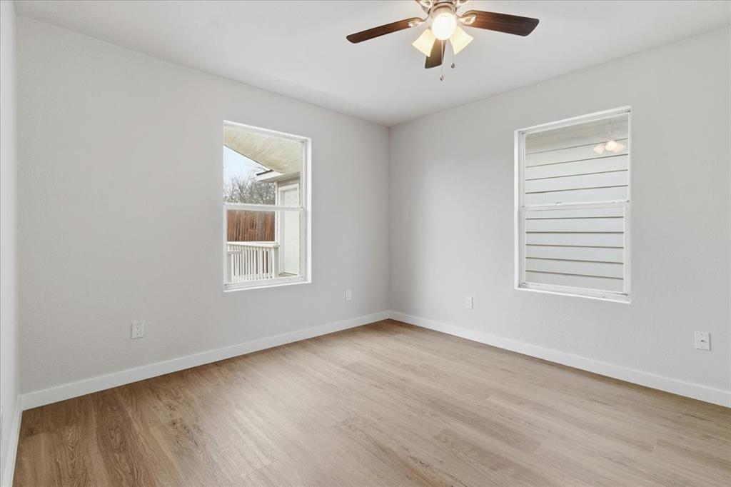 404 South Murray Street McKinney, TX 75069 - Photo 14 of 24 a view of an empty room with wooden floor and a window