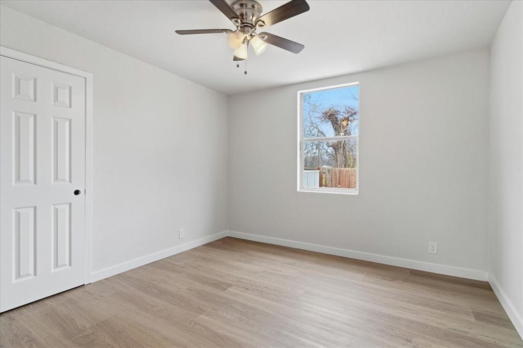404 South Murray Street McKinney, TX 75069 - Photo 16 of 24 wooden floor in an empty room with a window