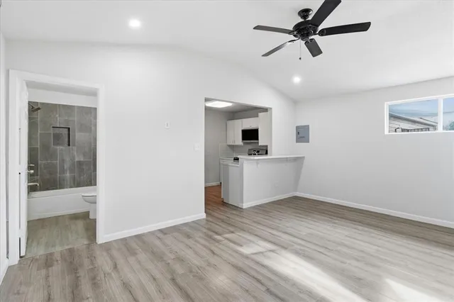 a view of kitchen with sink and microwave
