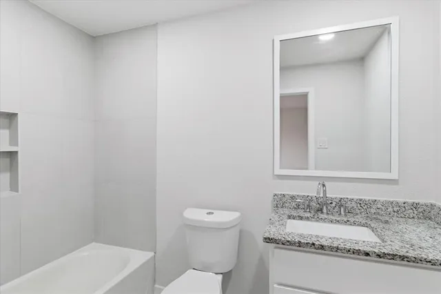 a bathroom with a sink and a toilet