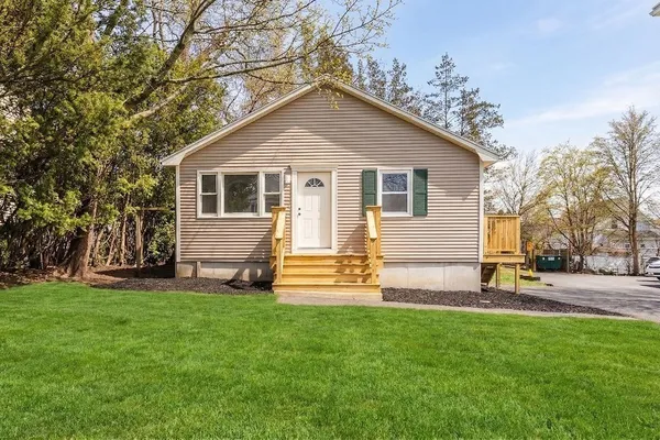a view of a house with a yard