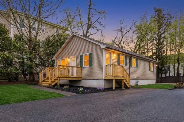 a view of a house with a yard