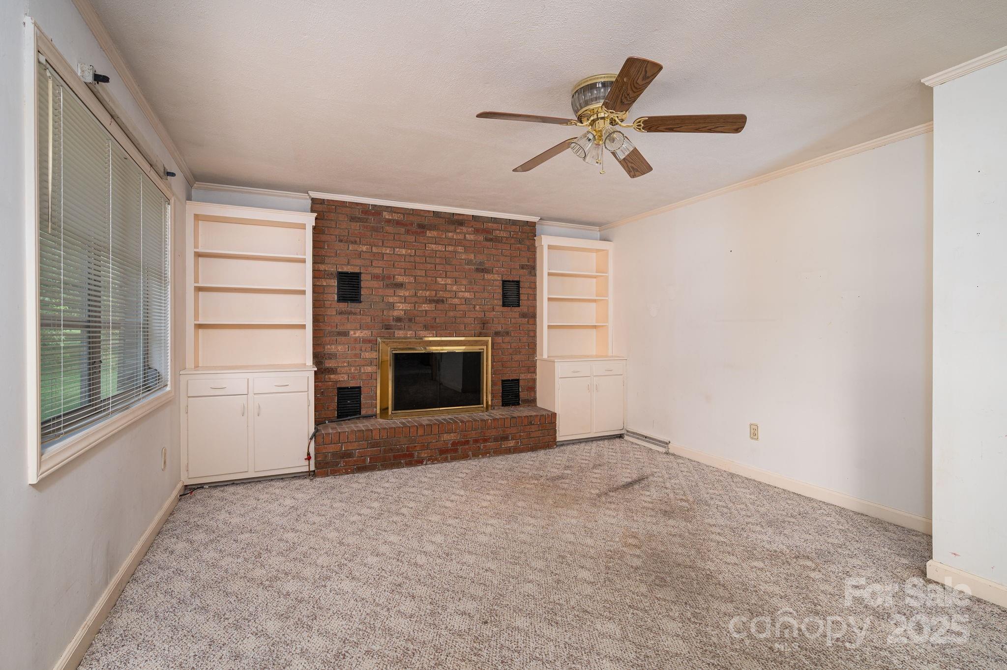 1585 Salem Church Road Lincolnton, NC 28092 - Photo 13 of 31 a view of an empty room with a fireplace