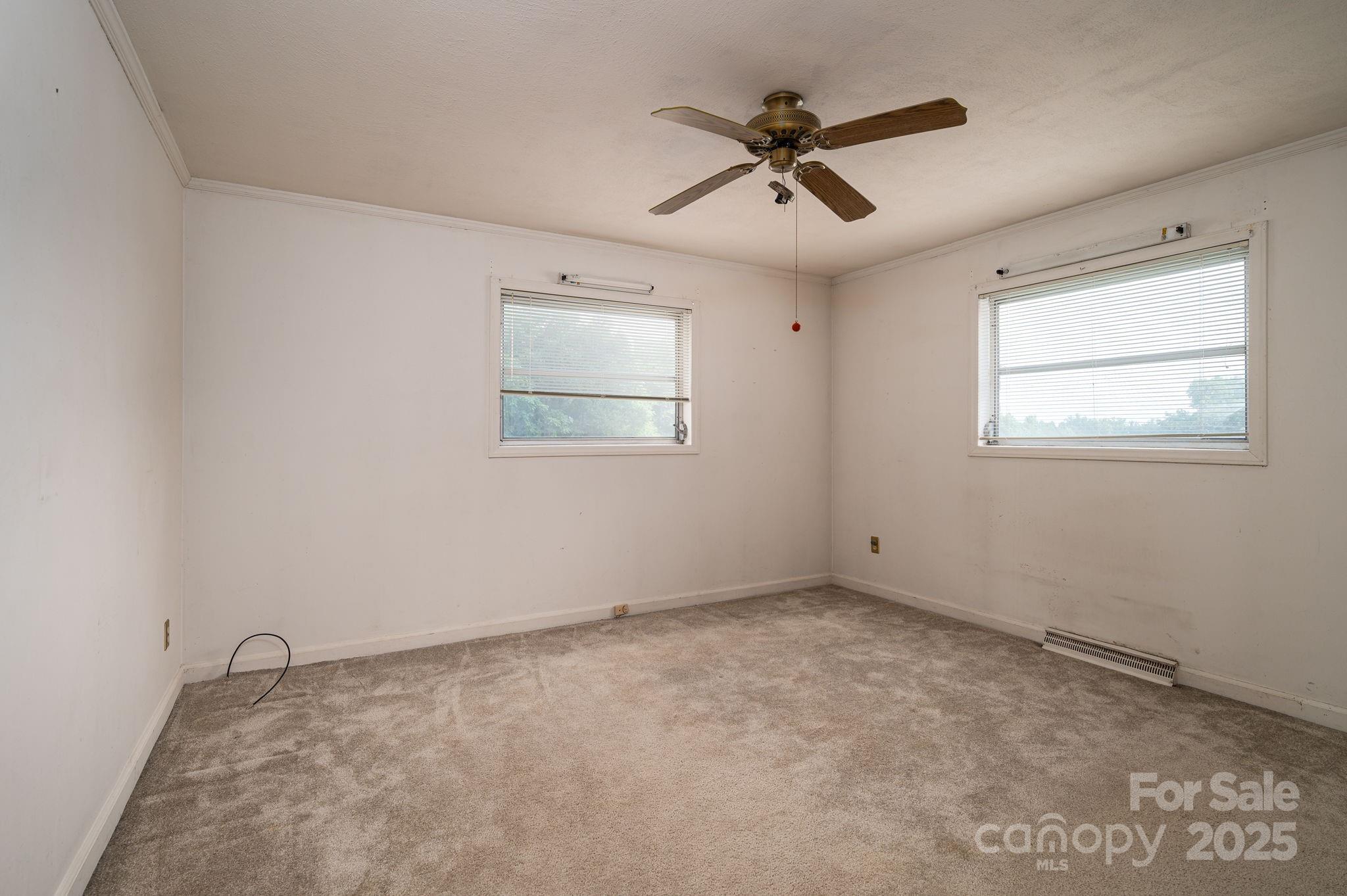 1585 Salem Church Road Lincolnton, NC 28092 - Photo 18 of 31 a view of a room with a ceiling fan and a window