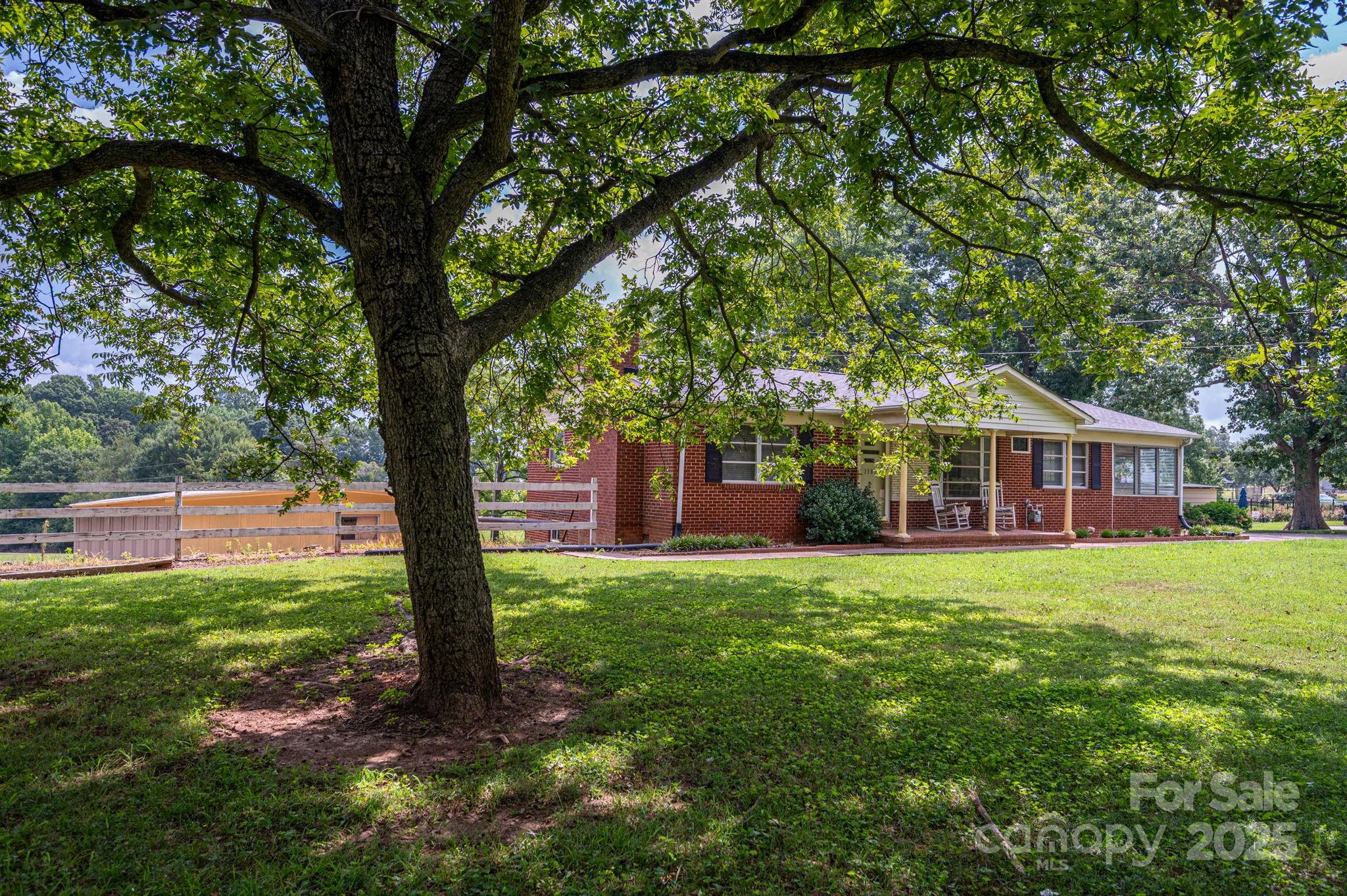 1585 Salem Church Road Lincolnton, NC 28092 - Photo 4 of 31 a front view of a house with a yard