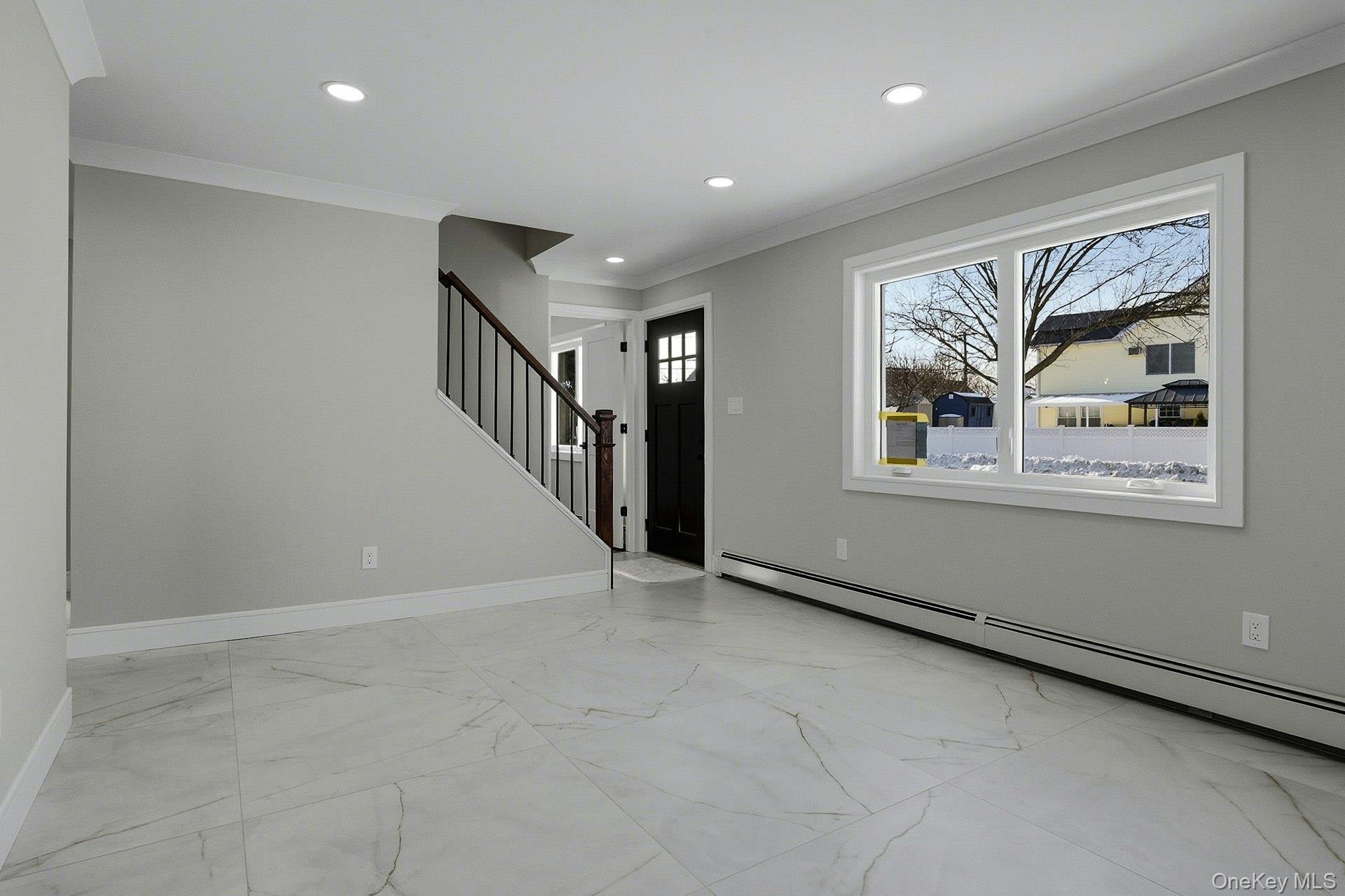 73 Wolcott Road Levittown, NY 11756 - Photo 12 of 31 a view of an empty room with a window