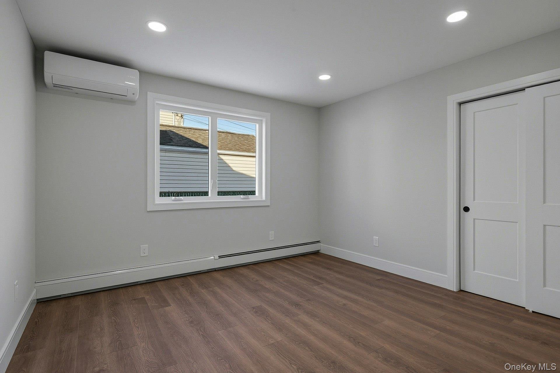 73 Wolcott Road Levittown, NY 11756 - Photo 14 of 31 a view of empty room with wooden floor and fan