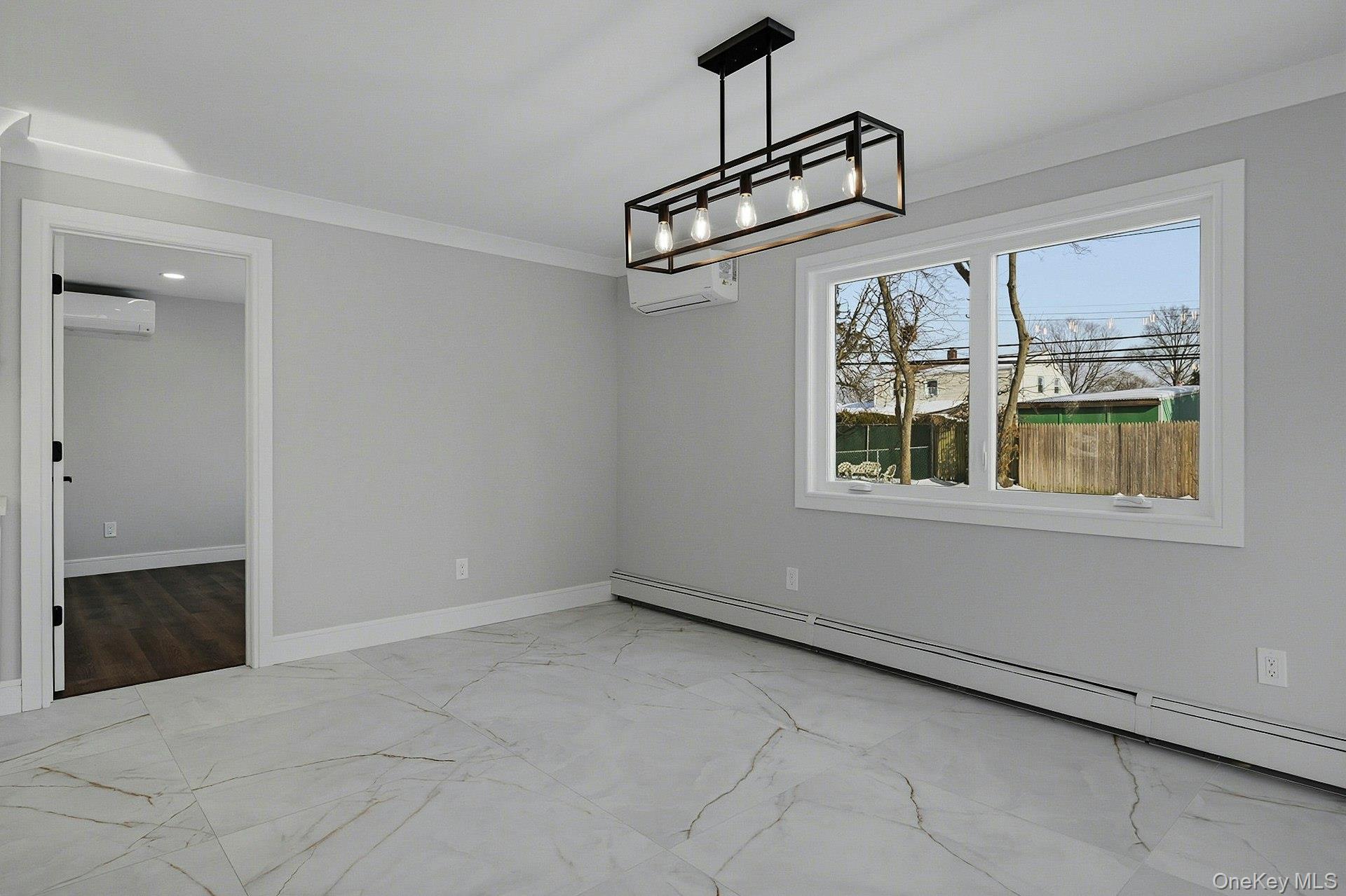 73 Wolcott Road Levittown, NY 11756 - Photo 21 of 31 a view of a livingroom with wooden floor and windows