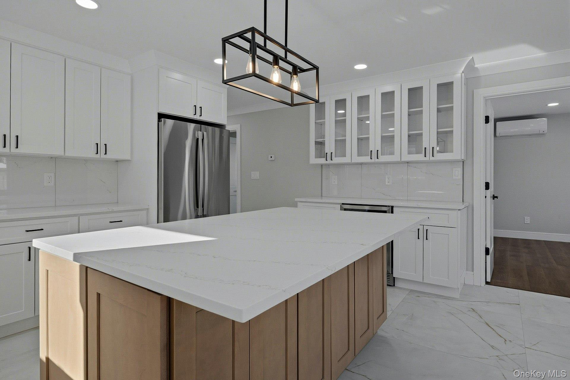 73 Wolcott Road Levittown, NY 11756 - Photo 22 of 31 a kitchen that has a cabinets a sink and a refrigerator