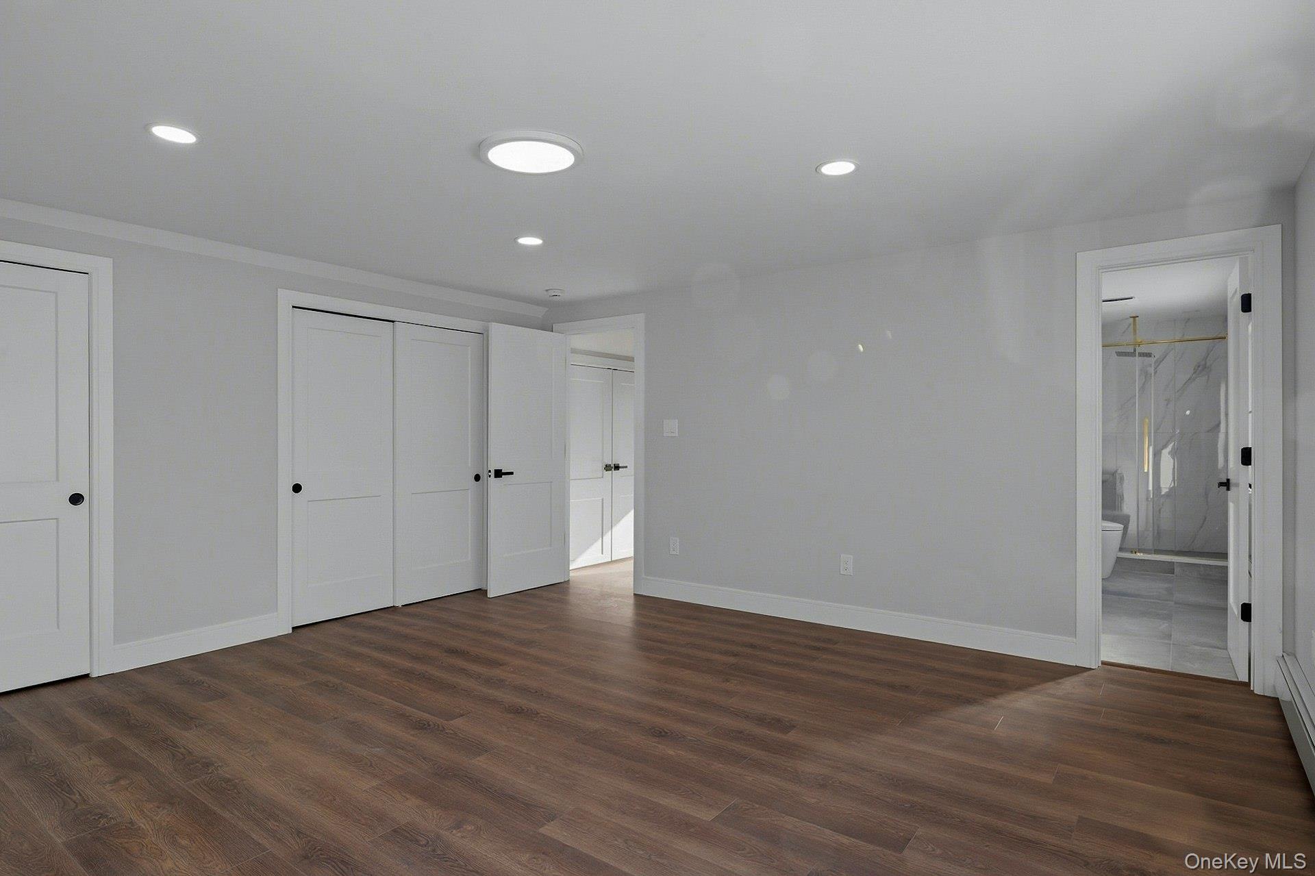 73 Wolcott Road Levittown, NY 11756 - Photo 28 of 31 a view of an empty room with wooden floor and closet