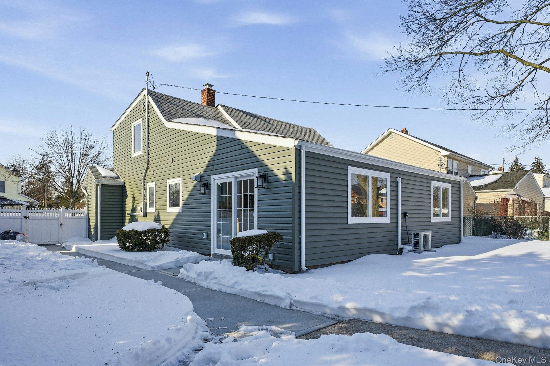 73 Wolcott Road Levittown, NY 11756 - Photo 3 of 31 a view of a house with a yard and garage
