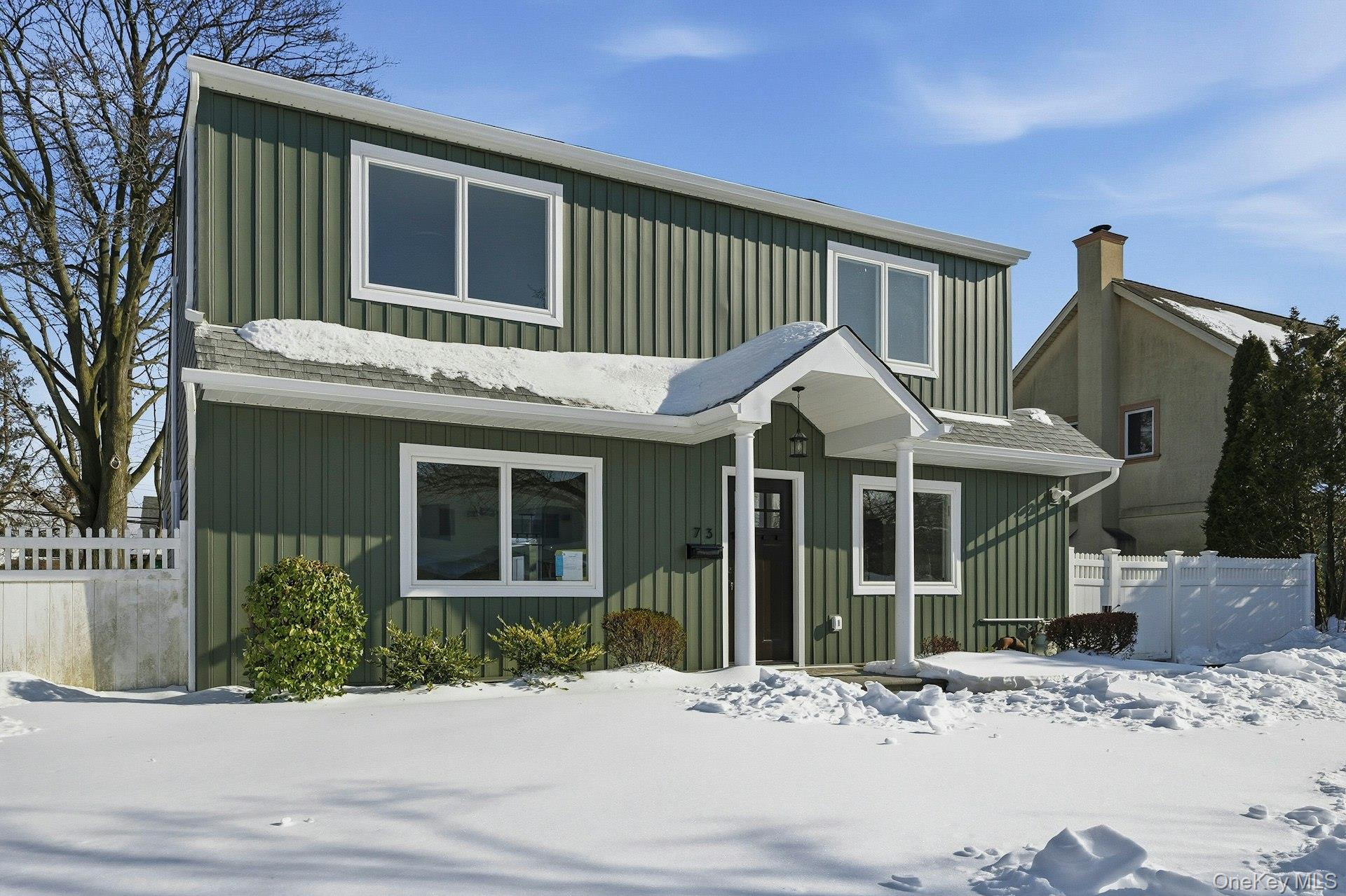 73 Wolcott Road Levittown, NY 11756 - Photo 6 of 31 a view of a house with a yard and potted plants