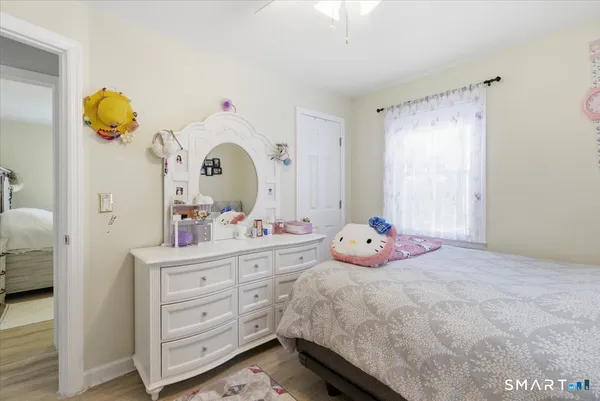 a bedroom with a bed and a dresser