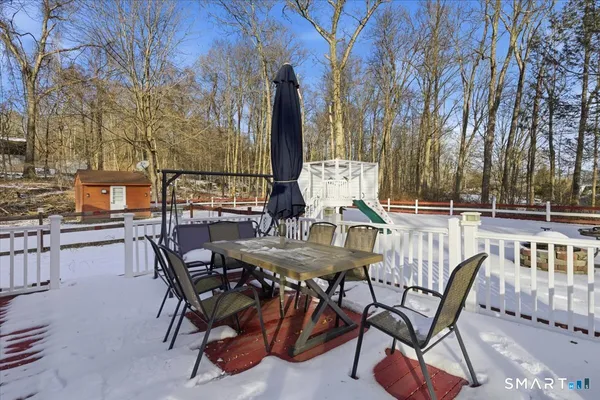 a view of a dinning table and chairs in the patio