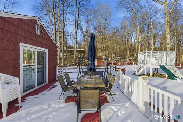 a view of a patio with iron fence
