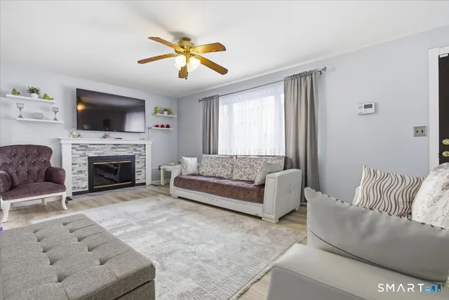 a living room with furniture and a flat screen tv
