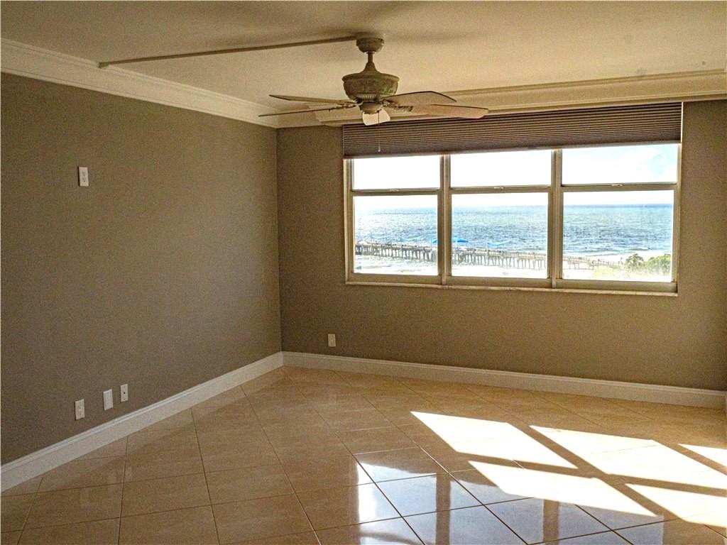 328 North Ocean Boulevard, Unit 1008 Pompano Beach, FL 33062 - Photo 12 of 38 a view of a livingroom with an empty space and a window