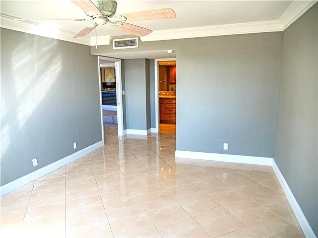 a living room with a large window and table