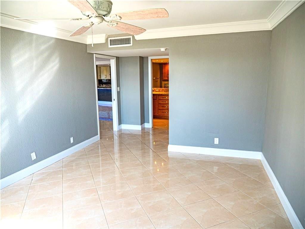 328 North Ocean Boulevard, Unit 1008 Pompano Beach, FL 33062 - Photo 13 of 38 wooden floor in an empty room with a window