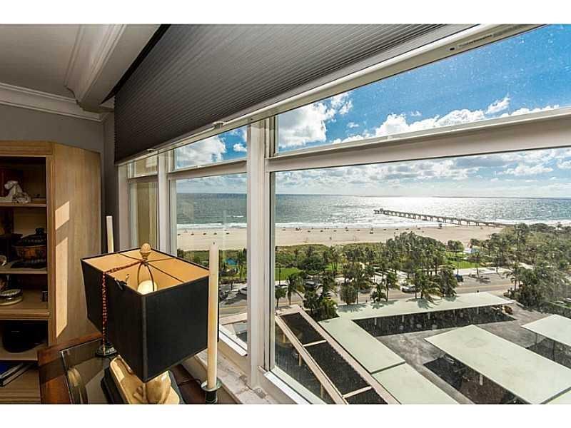 328 North Ocean Boulevard, Unit 1008 Pompano Beach, FL 33062 - Photo 14 of 38 a living room with a large window and table