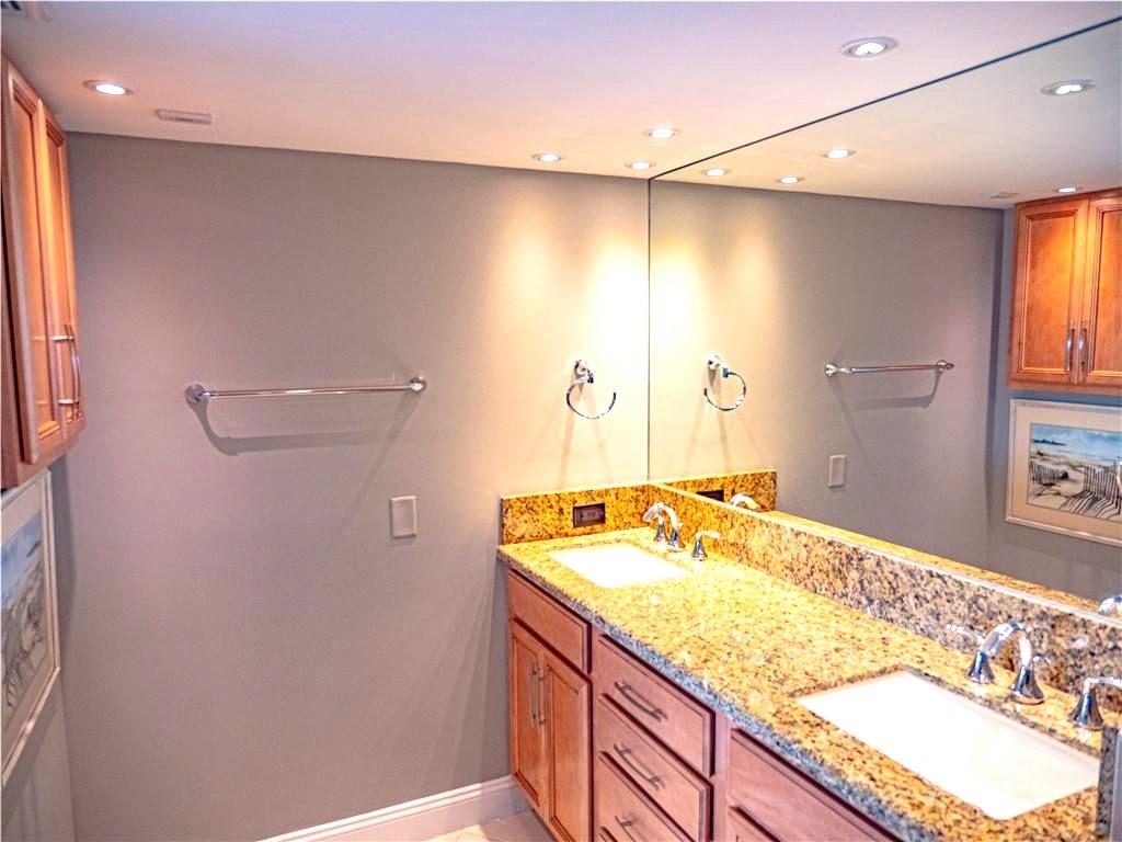 328 North Ocean Boulevard, Unit 1008 Pompano Beach, FL 33062 - Photo 15 of 38 a bathroom with a granite countertop sink and a mirror