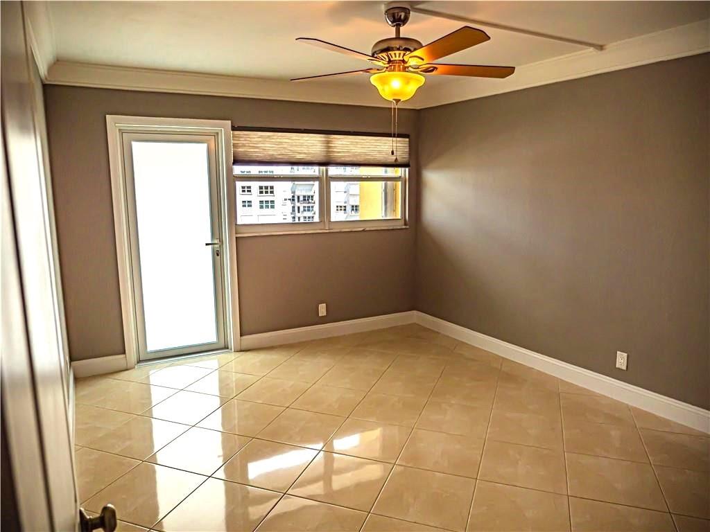 328 North Ocean Boulevard, Unit 1008 Pompano Beach, FL 33062 - Photo 17 of 38 a view of an empty room with a window