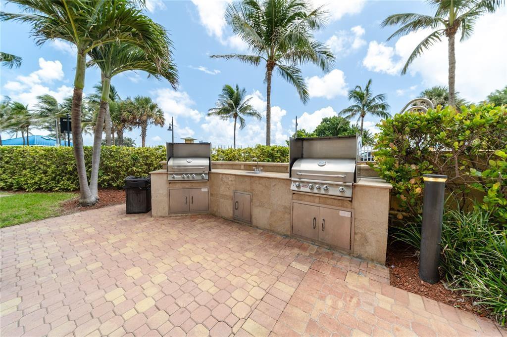 328 North Ocean Boulevard, Unit 1008 Pompano Beach, FL 33062 - Photo 22 of 38 a view of a kitchen with a stove