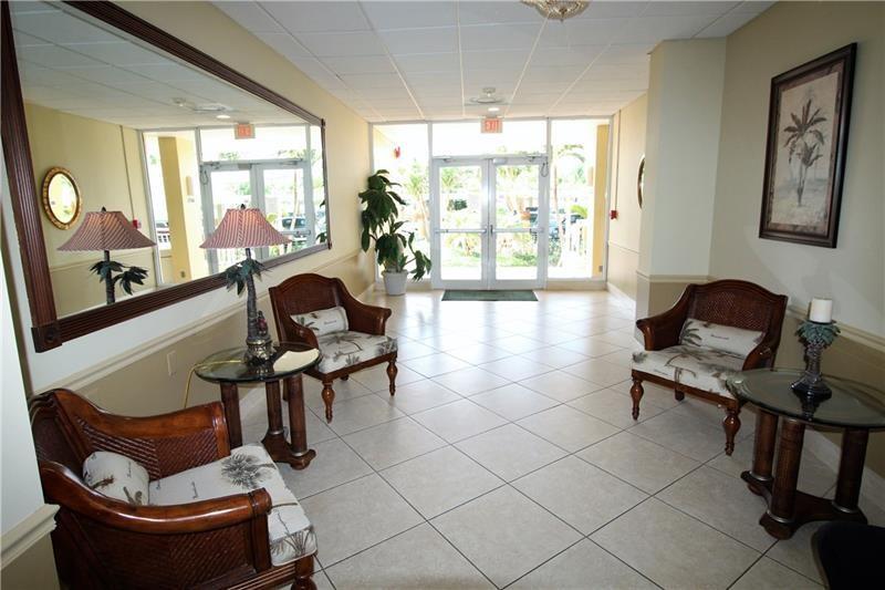 328 North Ocean Boulevard, Unit 1008 Pompano Beach, FL 33062 - Photo 26 of 38 a living room with furniture and a large window