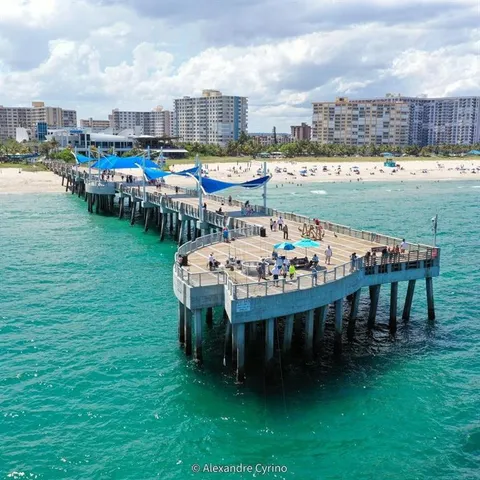 a terrace with outdoor seating and city view