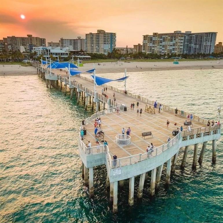 328 North Ocean Boulevard, Unit 1008 Pompano Beach, FL 33062 - Photo 35 of 38 a terrace with outdoor seating and city view