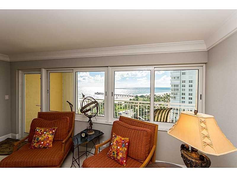328 North Ocean Boulevard, Unit 1008 Pompano Beach, FL 33062 - Photo 4 of 38 a room with furniture and a large window