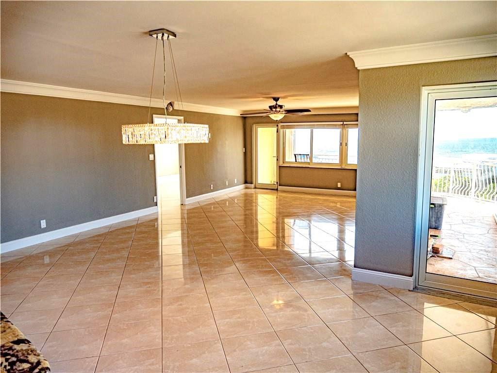 328 North Ocean Boulevard, Unit 1008 Pompano Beach, FL 33062 - Photo 5 of 38 a view of a livingroom with a chandelier