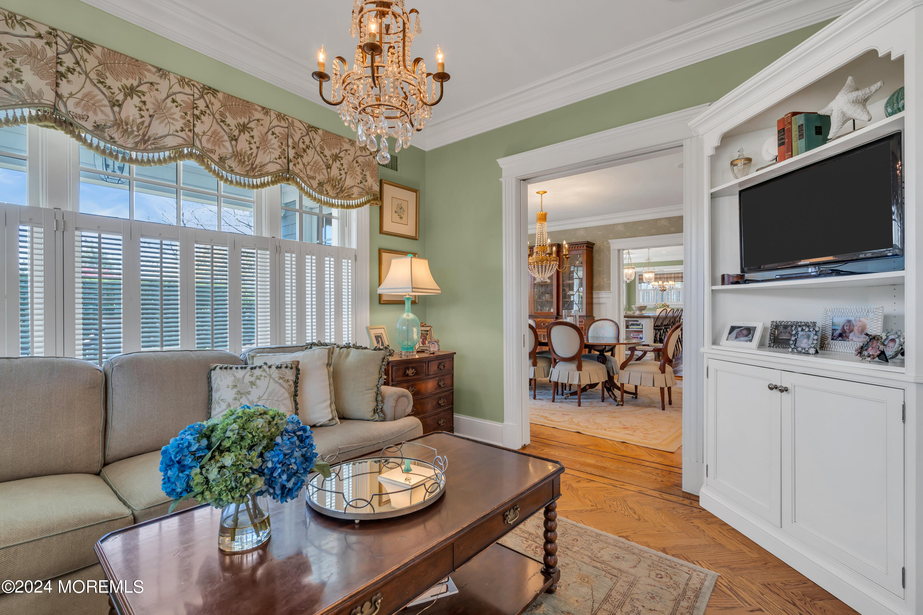 801 5th Avenue Spring Lake, NJ 07762 - Photo 11 of 97 a living room with furniture chandelier and a flat screen tv