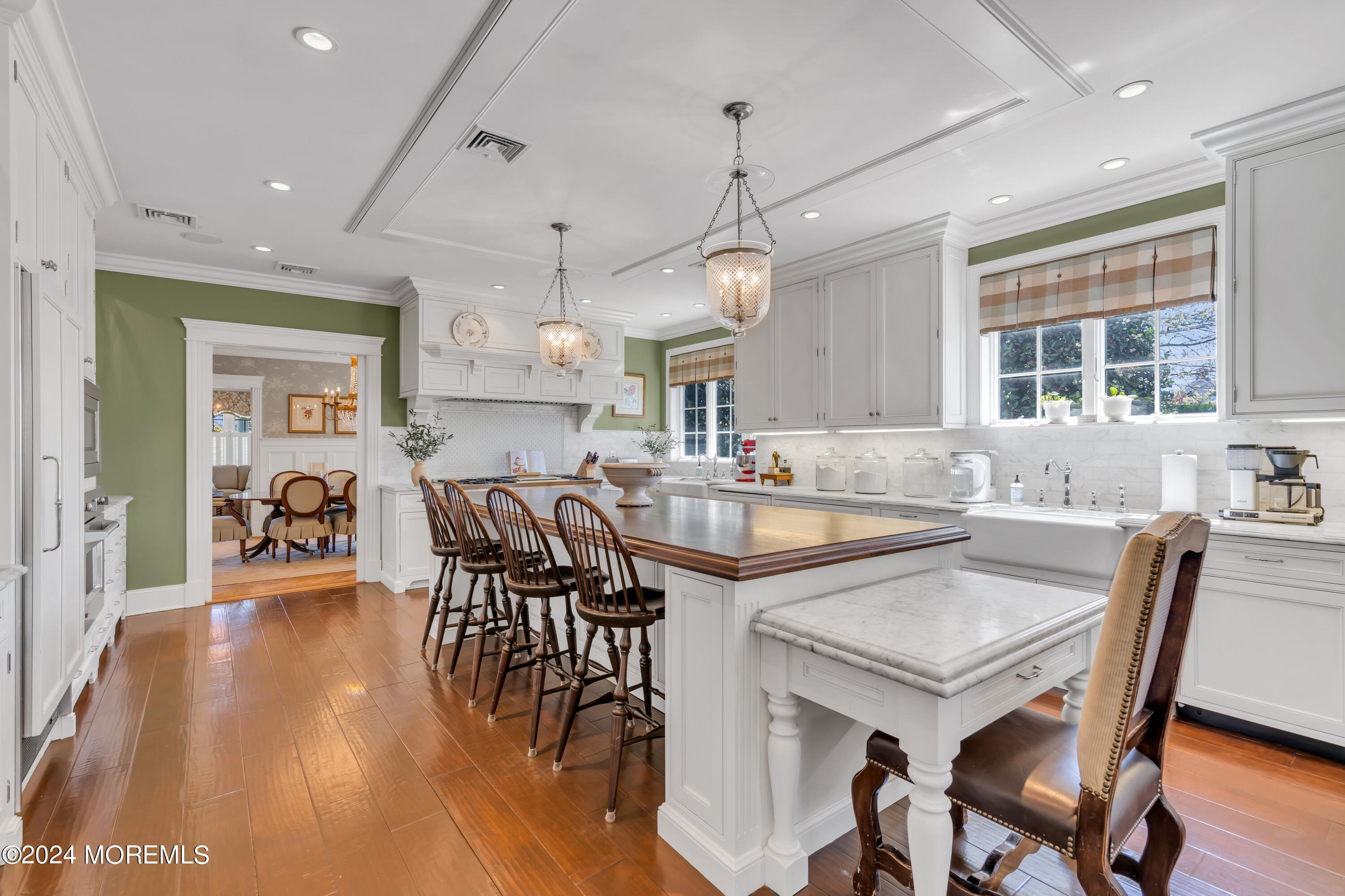 801 5th Avenue Spring Lake, NJ 07762 - Photo 20 of 97 a kitchen with granite countertop a dining table chairs and wooden floor