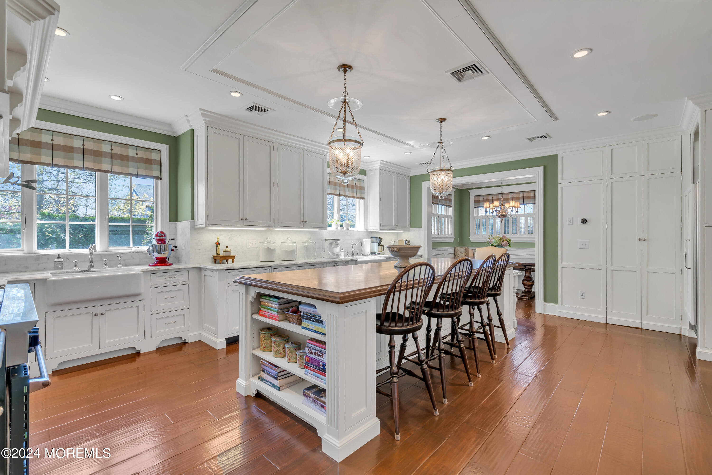 801 5th Avenue Spring Lake, NJ 07762 - Photo 22 of 97 a kitchen with stainless steel appliances granite countertop a stove a sink dishwasher a dining table and chairs with wooden floor