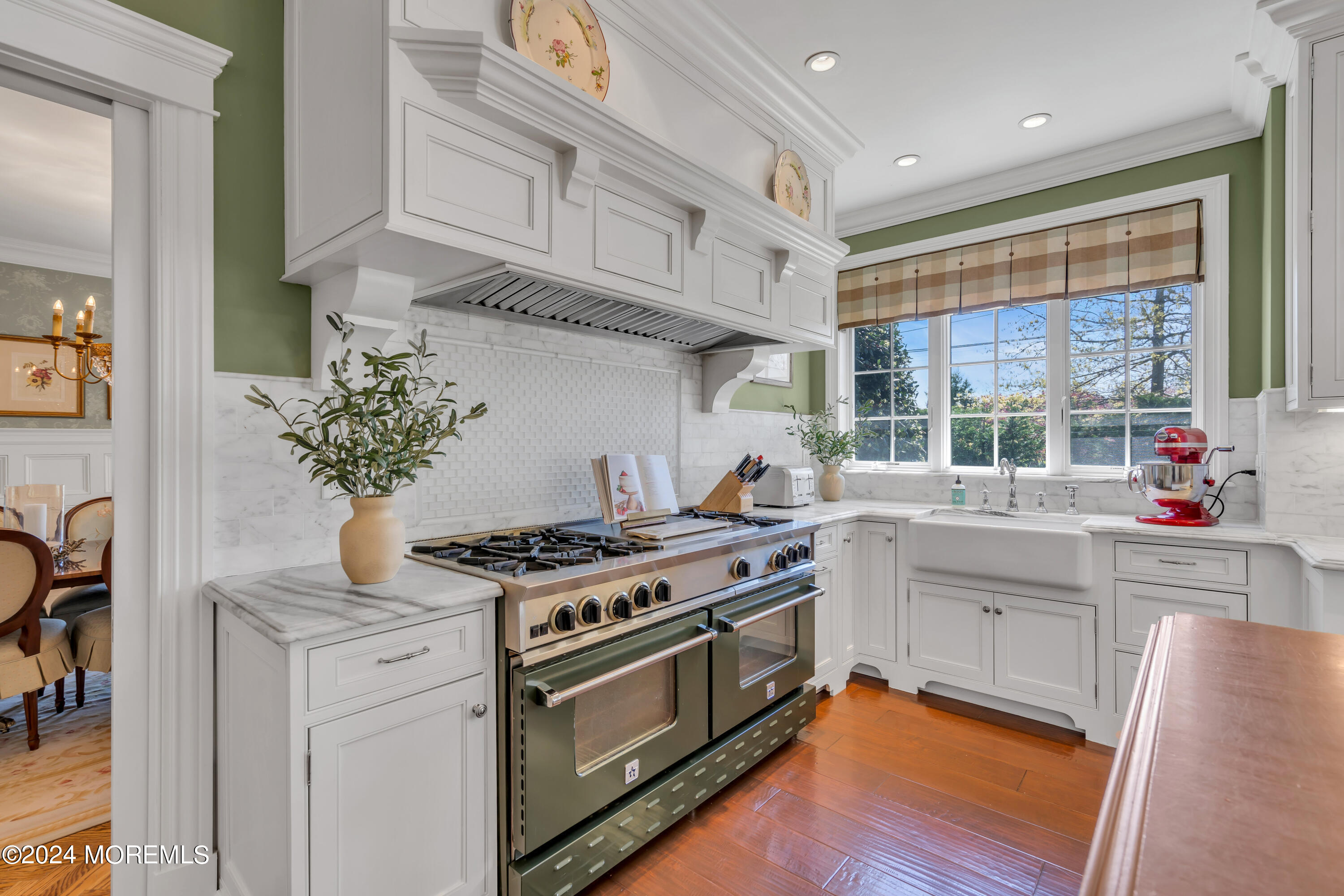 801 5th Avenue Spring Lake, NJ 07762 - Photo 26 of 97 a kitchen with stainless steel appliances granite countertop a stove and a white cabinets